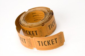 orange ticket stubs on white background, either say ticket or keep this coupon